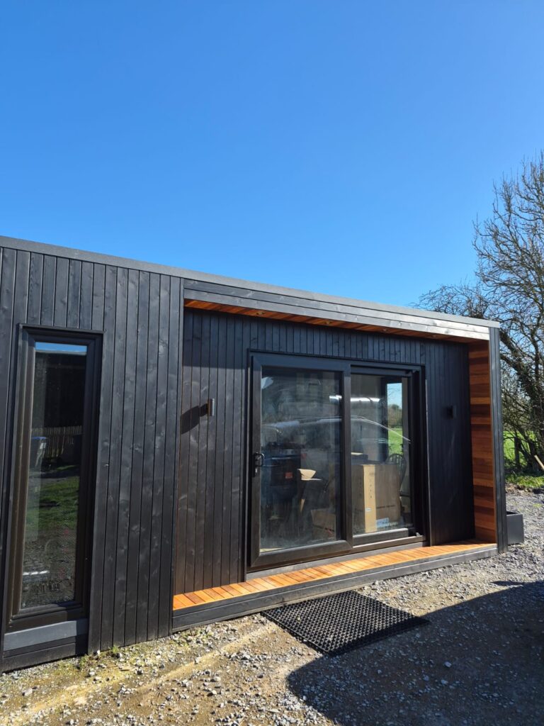 Carlow garden pod with sliding doors and timber cladding